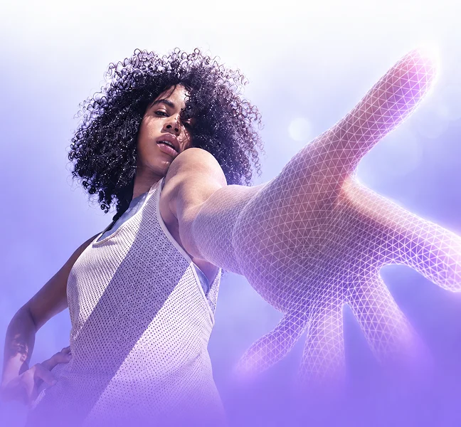 A colleague reaching towards the camera against a violet backdrop